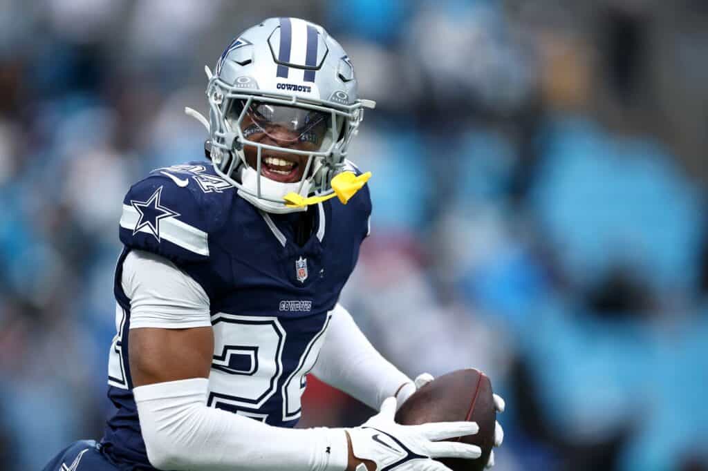Dallas Cowboys player Israel Mukuamu wearing a number 24 navy blue jersey and silver pants. Cowboys Israel Mukuamu Deserves More Opportunities On Defense