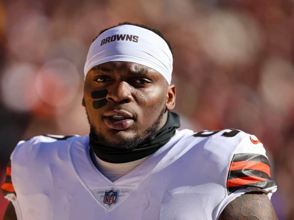 A football player with a white headband with Browns written across the front. The Cowboys Added a Wildcard to Their 2025 Defensive Line