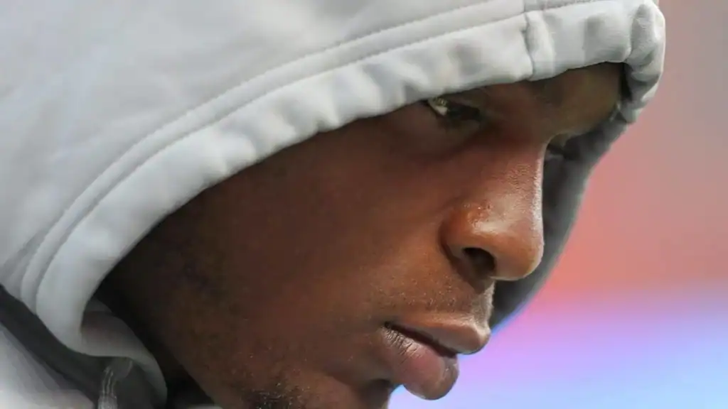 A man in a gray hood looking down in concentration. The Cowboys Added a Wildcard to Their 2025 Defensive Line
