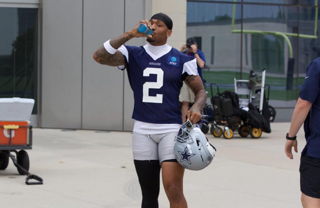 2 underrated defenders are getting their chance to shine at Cowboys OTAs - 2025 Defense, 2025 OTAs, Cornerback Cowboys' S Juanyeh Thomas, wearing a blue #2 jersey, takes a drink of water while walking out to Cowboys' practice at 2025 OTAs