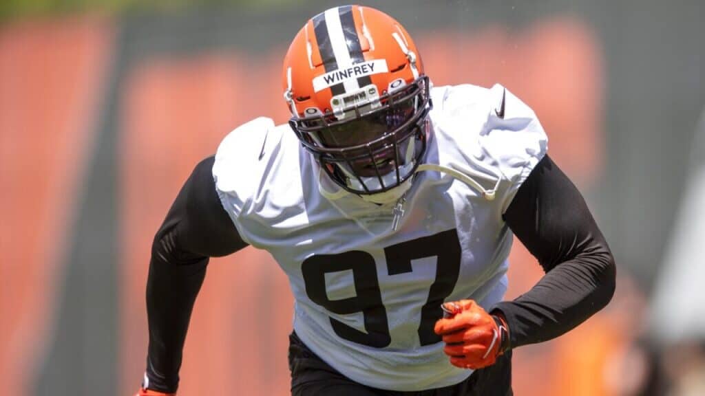 Cowboys ink 2 veterans to deals following individual workouts - Cornerback, Defensive Tackle, Free Agency A Browns player wearing a white #97 jersey runs downfield during a drill