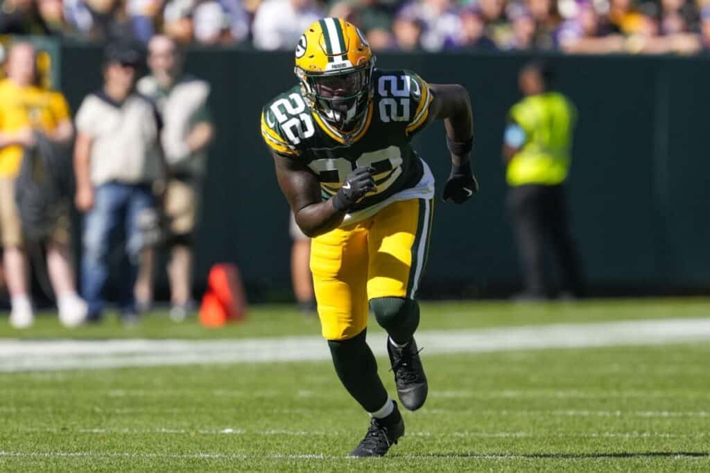 Cowboys ink 2 veterans to deals following individual workouts - Cornerback, Defensive Tackle, Free Agency A Packers player in a green #22 jersey runs downfield