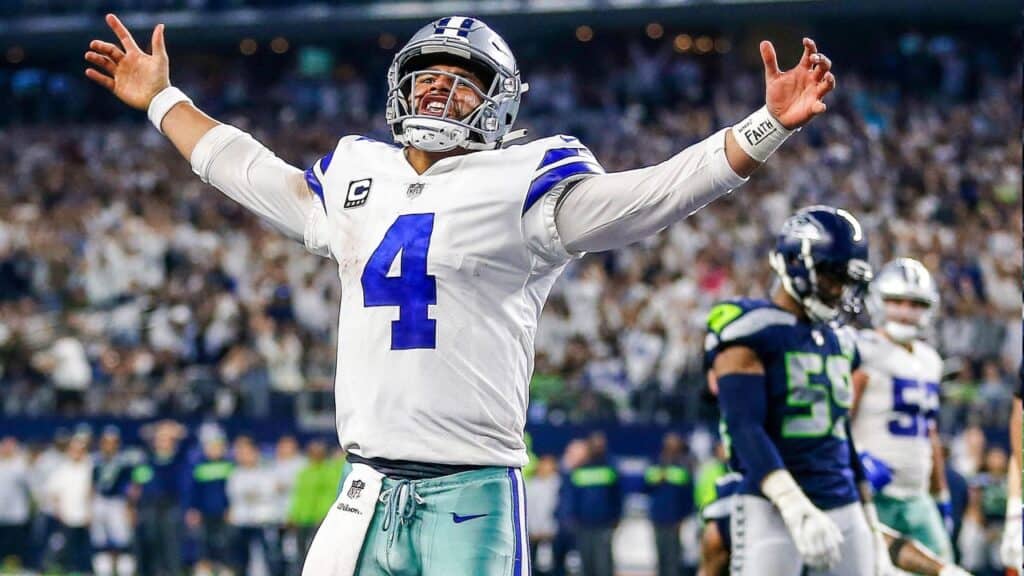 Dallas Cowboys quarterback Dak Prescott celebrating with his hands held high. Cowboys 2025 Offense: Speed, Motion, And Power
