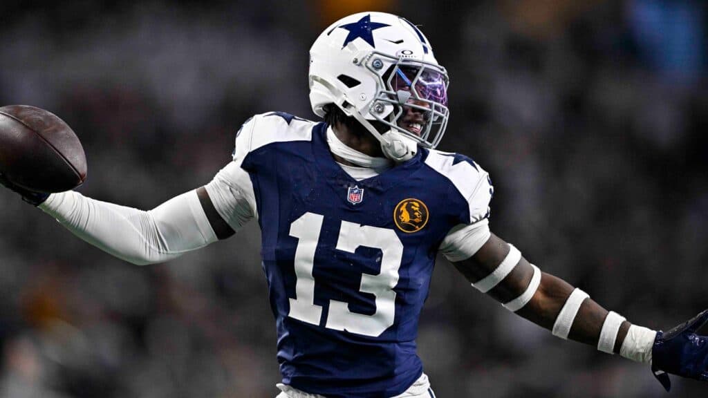 Dallas Cowboys' DeMarvion Overshown celebrating with the football in his hand. The Ultimate Dallas Cowboys 2025 Playoffs Prediction