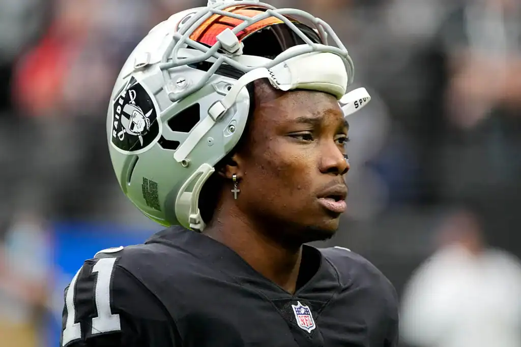 Las Vegas Raiders former player Henry Ruggs with his helmet resting on top of his head. Cowboys Fans Could Rally Behind a Henry Ruggs Signing in 2026
