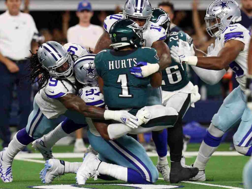 Dallas Cowboys defensive players sacking Eagles QB Jalen Hurts. The Ultimate Cowboys 2025 Schedule Series: Weeks1-5