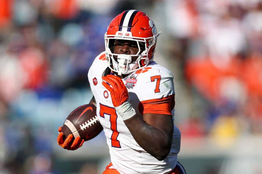 Dallas Cowboys rookie running back Phil Mafah runs with the footaball at Clemson University. 3 Cowboys Dark Horses Candidates Turning Heads at Camp