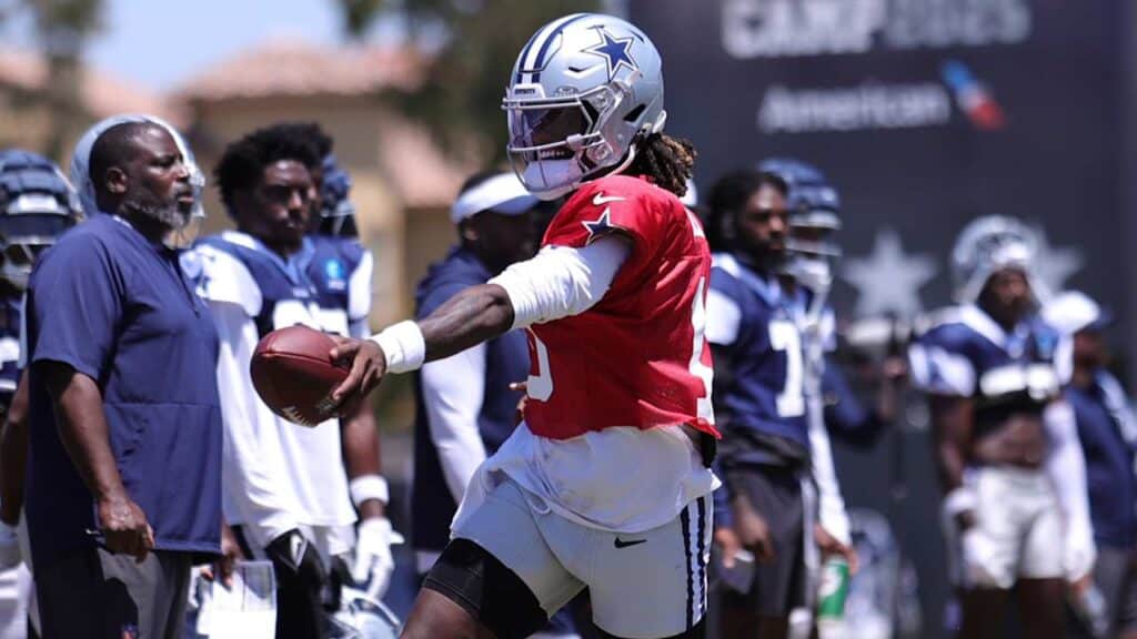 Dallas Cowboys quarterback Joe Milton runs with the football while wearing a red quarterback's jersey. Hidden Truths About Prescott, Milton, and the Cowboys in 2025